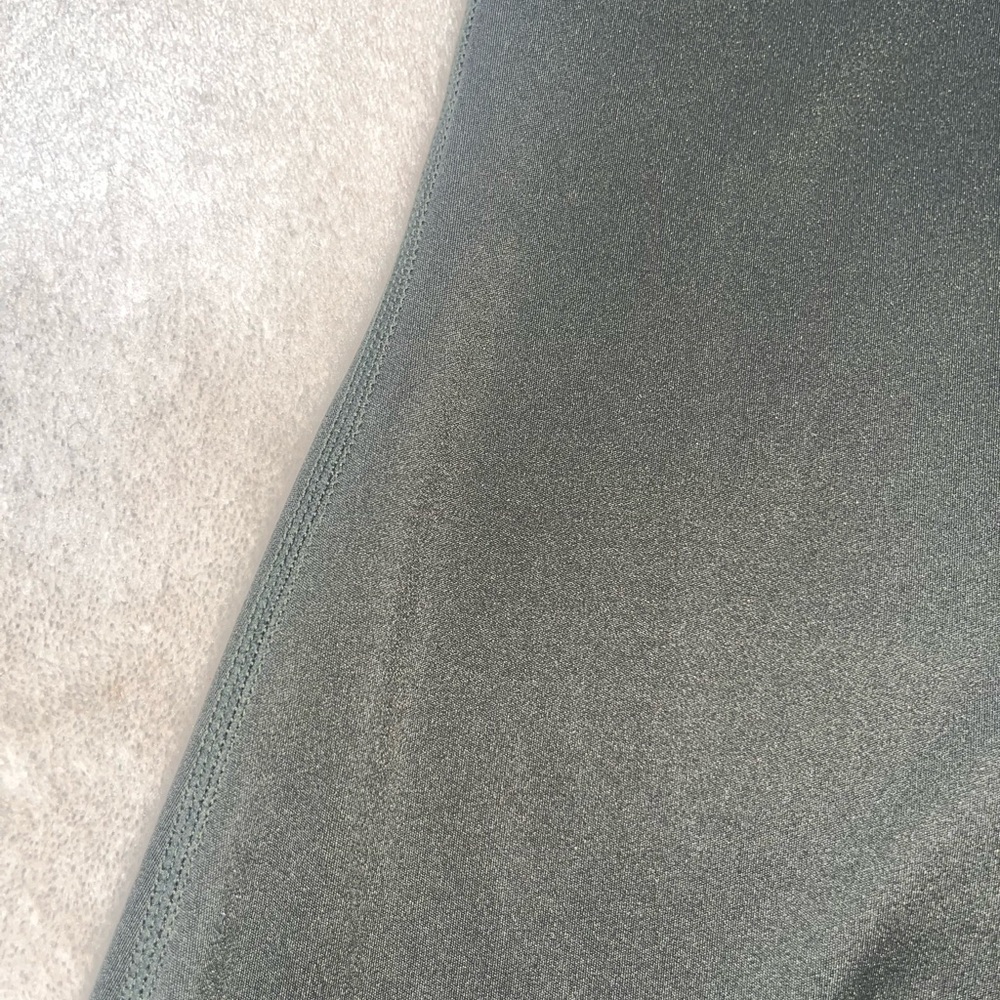 Forrest green body suit. Swim suit material like